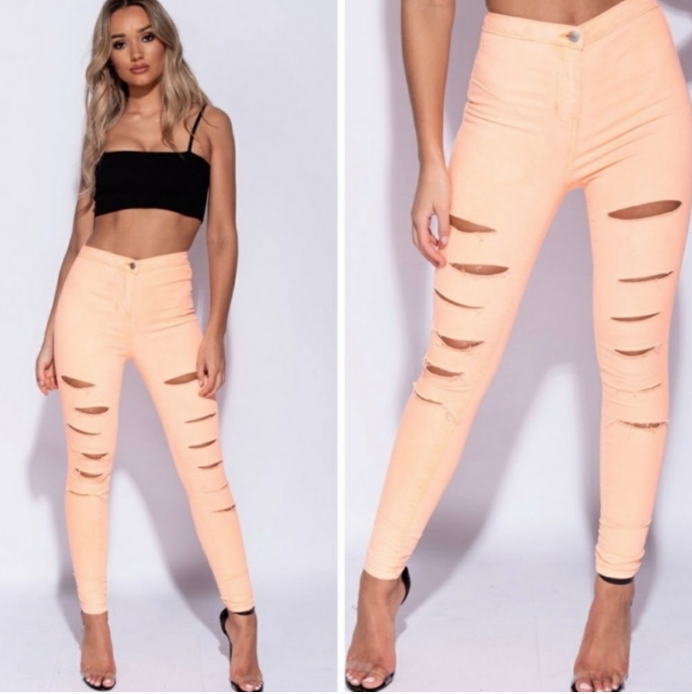 Distressed neon orange pants